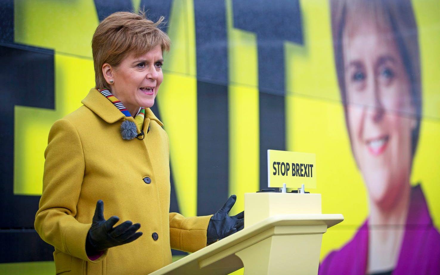 Scottish National Party (SNP) leader Nicola Sturgeon launches the party's election campaign bus, featuring a portrait of herself, at Port Edgar Marina in the town of South Queensferry, Scotland, before setting off on a tour of Scotland for the final week of the SNP's General Election campaign, Thursday Dec. 5, 2019.  Britain's Brexit is one of the main issues for all political parties and for voters, as the UK goes to the polls in a General Election on Dec. 12. (Jane Barlow/PA via AP)  LRC817